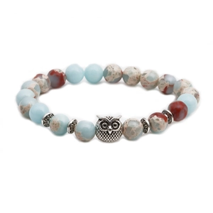 Close-up of owl beaded bracelet with Shoushan stone, blue sodalite, and vintage silver spacer