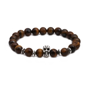 Detail view of tiger eye beads bracelet with silver skull charm and carved spacers
