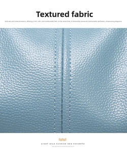 Close-up of blue lychee grain leather with neat double-stitched vertical seams