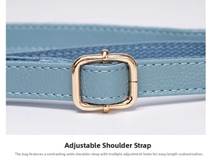 Detail of adjustable blue lychee pattern leather shoulder strap with gold metal buckle