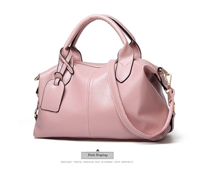 Close-up of pink lychee pattern leather texture and high-quality gold zipper detail