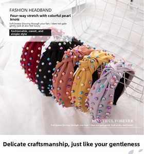Macro shot of assorted knotted headbands with colorful gradient pearls in multiple colors