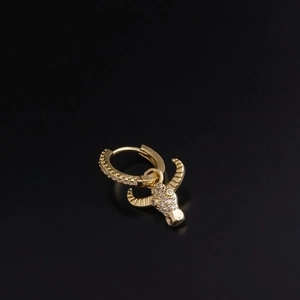 Golden hoop earrings featuring a bull head pendant set with clear zircons and black enamel
