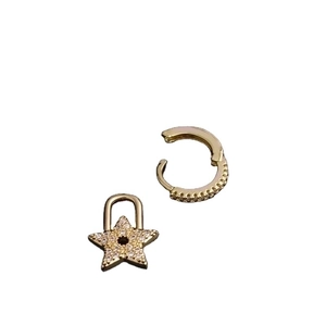 Gold earrings set featuring a sparkling cubic zirconia hoop and a star-shaped lock pendant