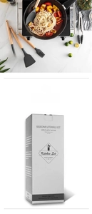 Detail of dark grey silicone kitchen utensils with wooden handles and packaging box