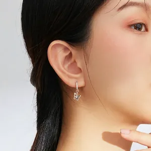 Elegant S925 sterling silver butterfly drop earrings with cubic zirconia on female model