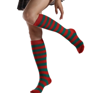 Close-up of red and green striped over-knee high socks featuring soft knit texture