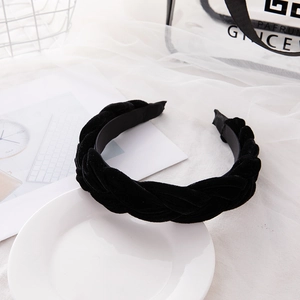 Elegant black velvet braided headband for women in a retro minimalist twisted design