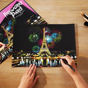 DIY Paris Eiffel Tower fireworks night scene scratch art set on a wooden desk