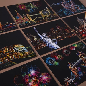 Artistic scratch art postcards featuring world landmarks like the Statue of Liberty