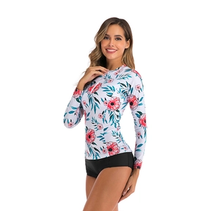 Women's long sleeve floral bikini set with sun protection and black swim shorts