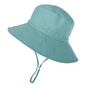 Detail of light blue sun hat featuring an adjustable windproof drawstring and fine stitching
