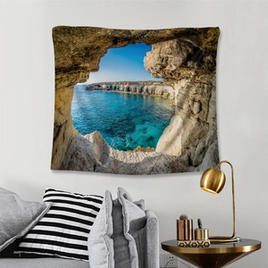 Detail of bohemian wall tapestry showing a clear blue sea view from a cave perspective