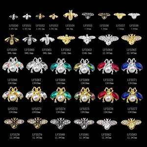 Matrix display of 3D metal bee nail art charms with crystal inlay and pearl details
