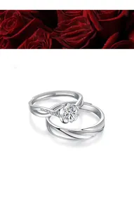 Detailed view of S925 sterling silver couple rings with floral and wave design