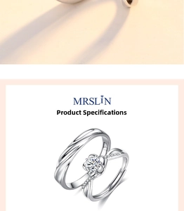 Detail of S925 sterling silver couple rings featuring a twisted band and zircon flower setting