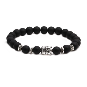 Detailed close-up of matte black agate beads with a silver Buddha head charm centerpiece