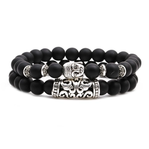 Matte black agate beaded bracelets set with silver Buddha head and textured spacer beads