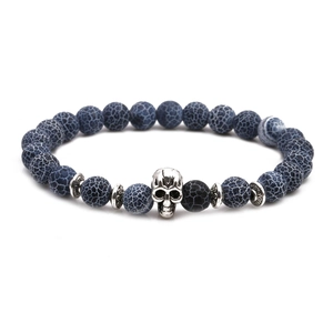 Detail of blue weathered stone beads with a silver skull charm and spacers
