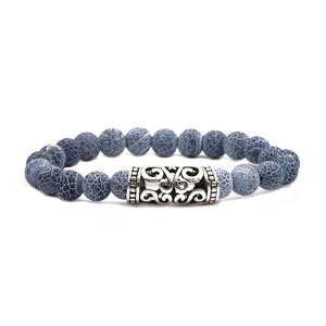 Dark blue weathered stone beaded bracelet with ornate silver hollow decorative charm