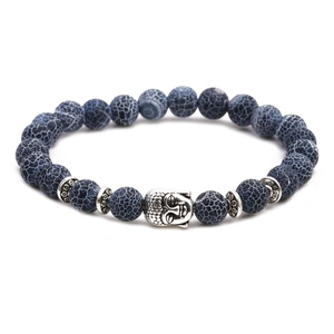 Macro detail of blue agate beads with mesh texture and silver Buddha head on the bracelet