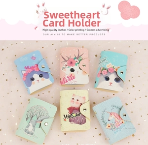 Detail of colorful cartoon PU leather card holders with metallic studs and snap buttons