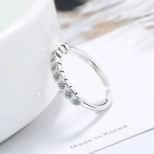 Elegant S925 silver open ring with seven sparkling round diamonds in a minimalist style