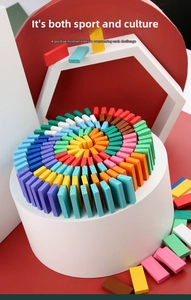 Artistic spiral arrangement of colorful wooden dominoes on a white cylindrical display stand