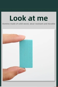 Close-up of solid wood cyan domino piece showing natural texture and sturdy thickness