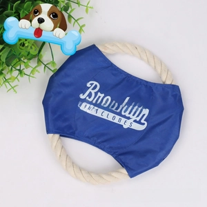 Macro shot of durable cotton rope dog frisbee with blue fabric and reinforced white stitching