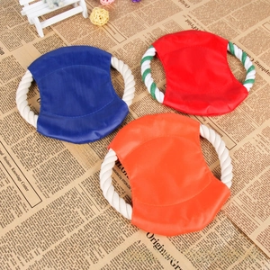Detail of durable nylon dog flying discs with cotton rope handles in three vibrant colors