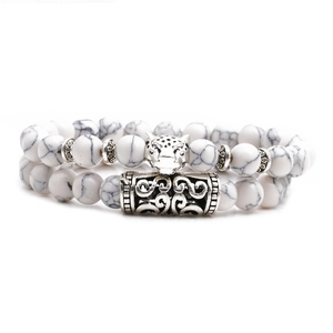 Double-layered white turquoise beaded bracelet featuring a silver leopard head charm