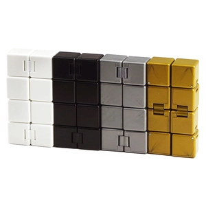 Detail view of folding infinity cubes in white, black, grey and gold for stress relief