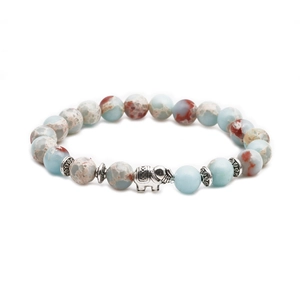 Detail of beaded bracelet featuring imperial stone beads and vintage silver elephant charm