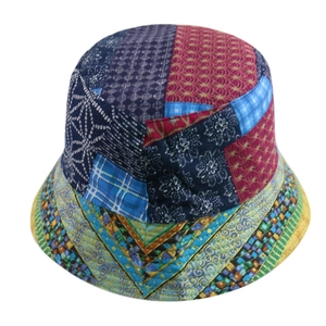 Close-up of patchwork fisherman hat with colorful floral patterns and ethnic prints
