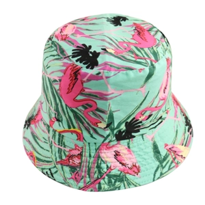 Mint green reversible bucket hat with pink flamingo and tropical palm leaf print pattern