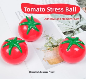 Macro shot of three red tomato-shaped stress relief squeeze balls on a white background