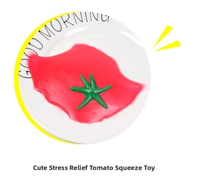 Detailed close-up of a squishy red tomato stress relief toy on a white ceramic plate