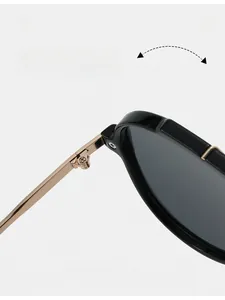 Macro shot of durable metal hinges on black oversized aviator sunglasses frame