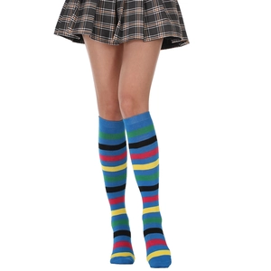 Close-up of knee-high socks with vibrant colorful stripes paired with a pleated skirt