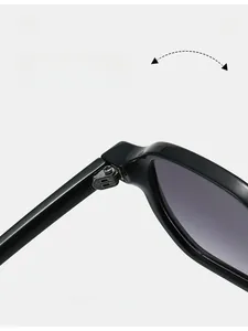 Close-up of durable metal hinge on sleek black fashion sunglasses with silver screw detail