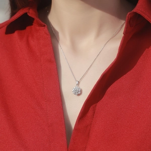 Elegant 925 sterling silver flower necklace with sparkling moissanite petals on model