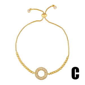 Adjustable gold snake chain bracelet with micro-paved cubic zirconia ring charm centerpiece