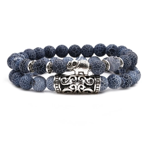 Blue-grey beaded bracelet set featuring silver elephant charm and textured metal beads
