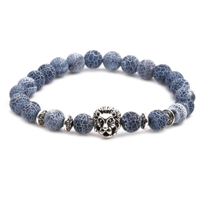 Detail of blue crackle agate bead bracelet featuring an intricate silver lion head charm