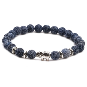 Detail of blue net stone beaded bracelet featuring a silver elephant charm and spacer beads