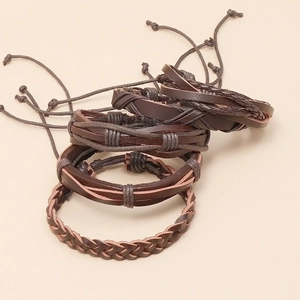 Set of four vintage dark brown braided leather bracelets with adjustable knot closure