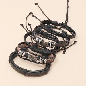 Handmade multi-layer leather bracelet set with metallic wing and braided cord details