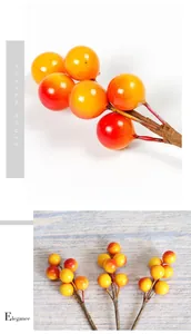 Close-up of artificial berries with orange-red gradient and flexible brown stems