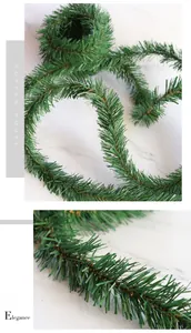 Detailed macro view of dense green PVC pine needle garland for festive holiday decoration